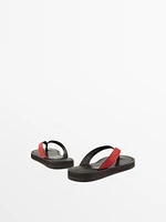 Split suede sandals with toe divider