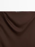 Jupe midi fluide en tissu satiné