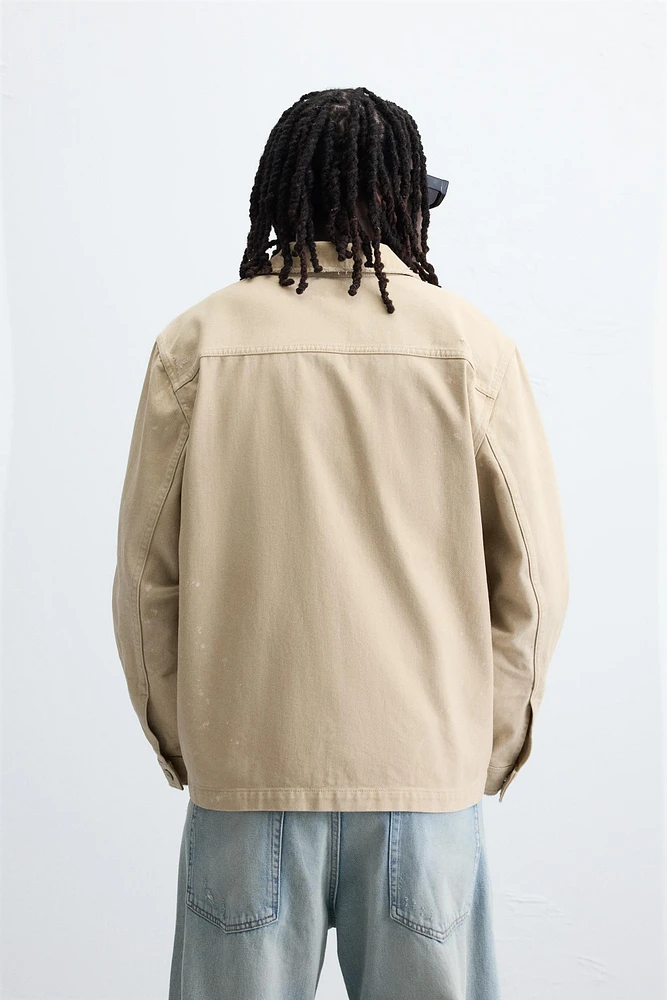 VESTE DÉLAVÉE À ÉCLABOUSSURES