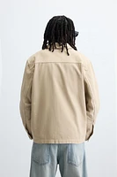 VESTE DÉLAVÉE À ÉCLABOUSSURES