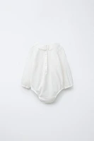 BOUND NECKLINE BODYSUIT