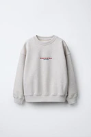 HEATHERED TEXT SWEATSHIRT