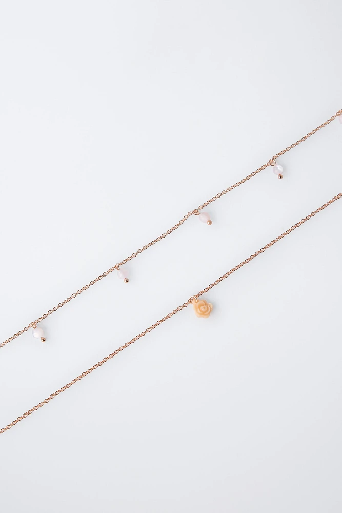 LOT DE DEUX COLLIERS ET BAGUE FLEUR