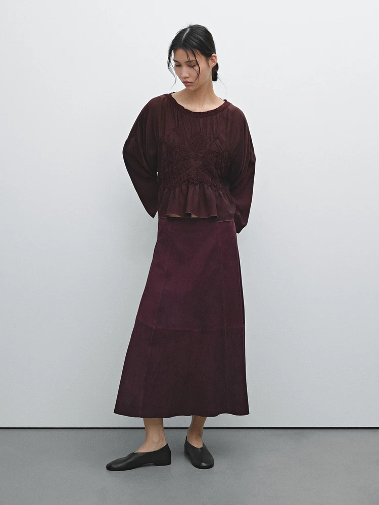 Flowing blouse with gathered detail