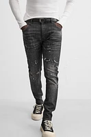 SPLATTERED RIPPED SKINNY JEANS