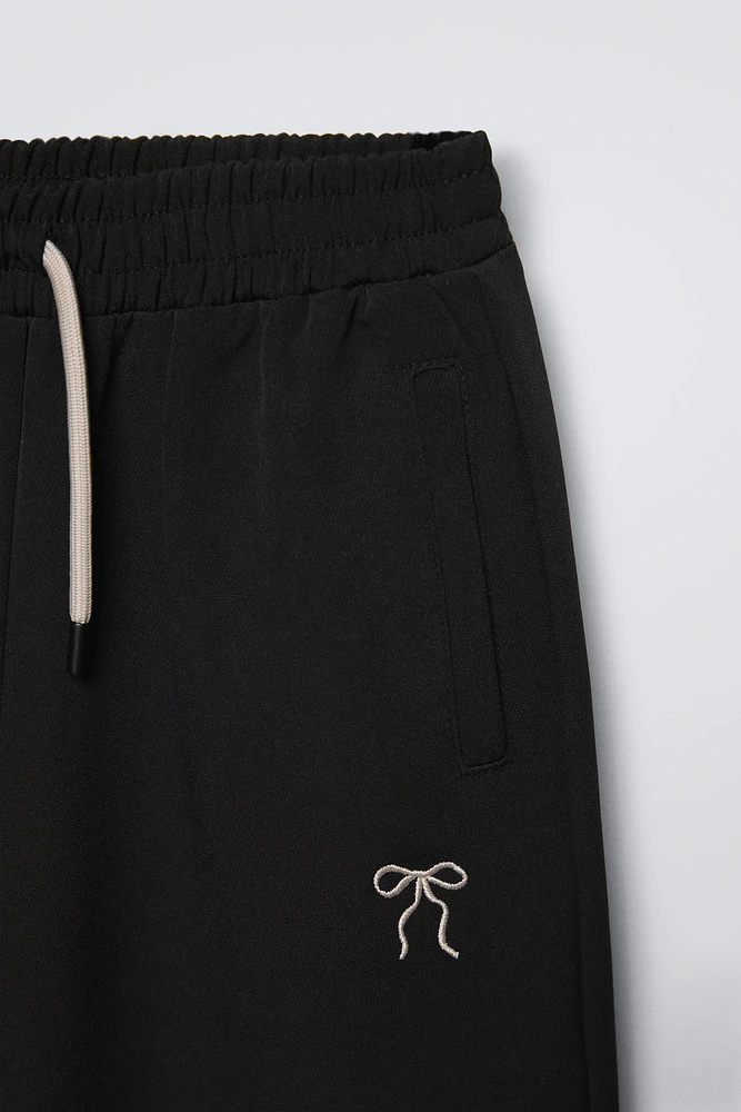 EMBROIDERED BOW WIDE LEG PANTS