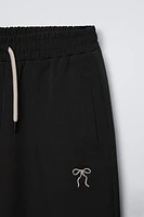 EMBROIDERED BOW WIDE LEG PANTS