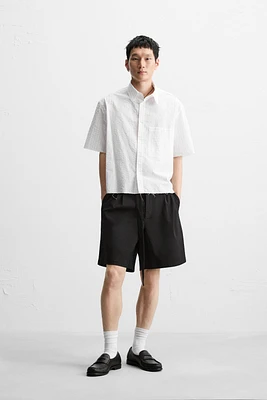 PLEATED BERMUDA SHORTS WITH BELT
