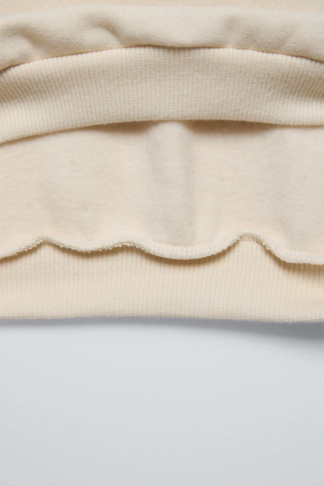 SWEATSHIRT WITH PATCHES