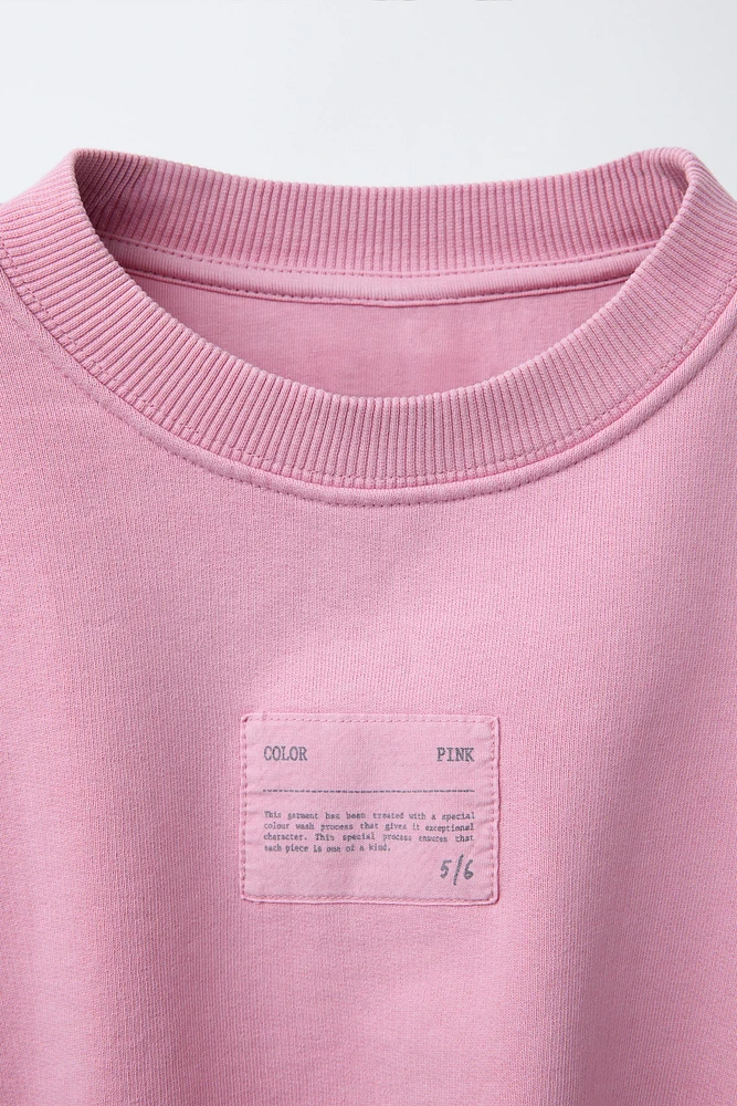 LABEL DETAIL BALLOON-HEM CROPPED SWEATSHIRT