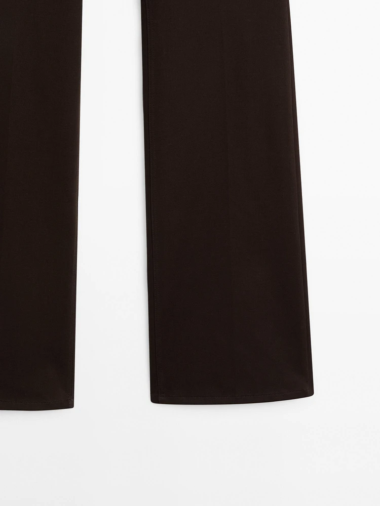 Pantalon slim flare taille basse