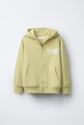 SWEAT À INSCRIPTION AVEC ZIP