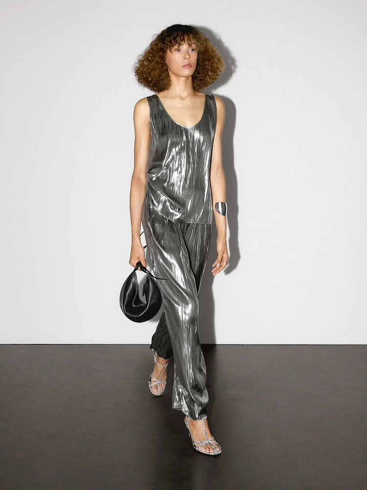 Flowing metallic trousers with gathered detail