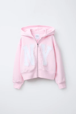 CROPPED VARSITY ZIP-UP HOODIE
