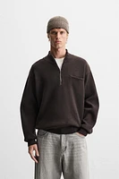 QUARTER ZIP SWEATER