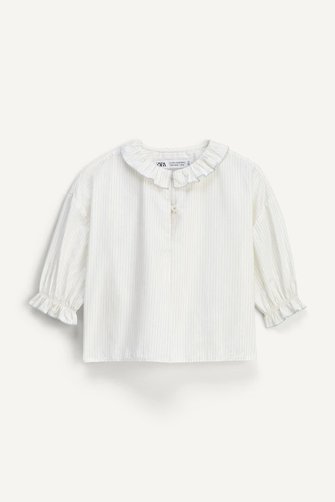 LIMITED EDITION RUFFLE TRIM STRIPED SHIRT