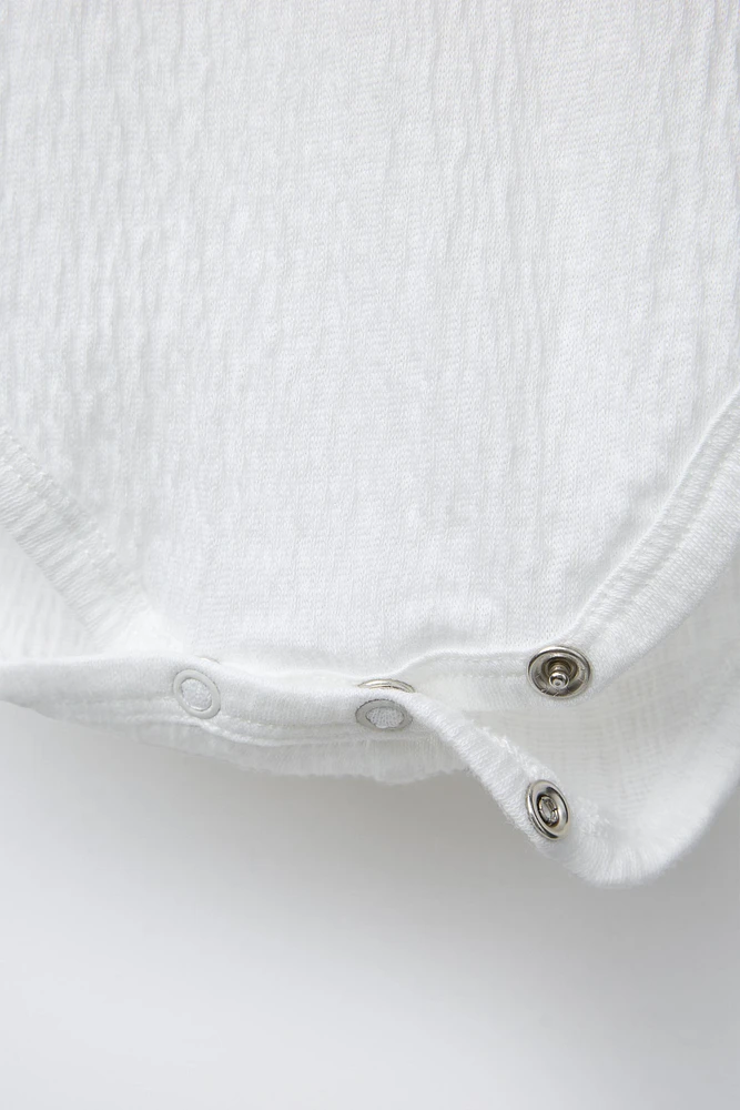 TEXTURED BODYSUIT