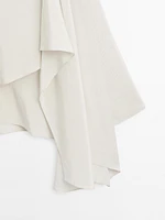 Short flowing cape with sleeve detail