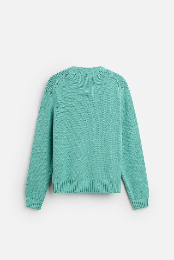 Relaxed fit cotton blend sweater. Round neck and long sleeves. Rib trim.