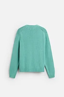 Relaxed fit cotton blend sweater. Round neck and long sleeves. Rib trim.