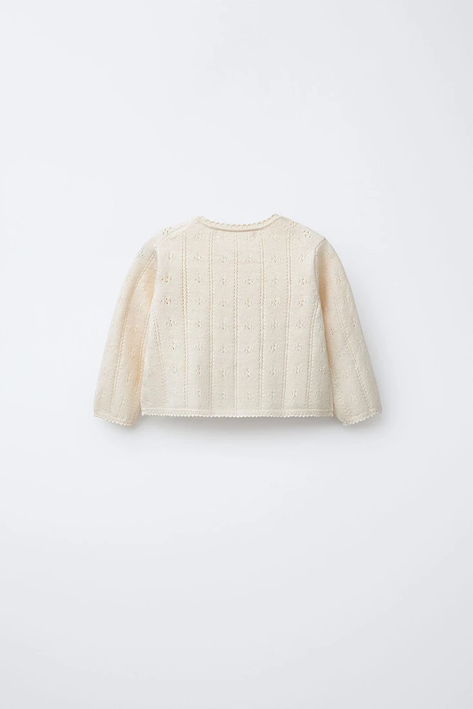 GILET EN MAILLE AJOURÉE ET BRODÉE