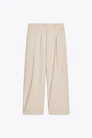 PLEATED CHINO PANTS