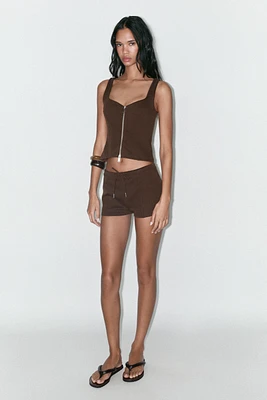 INTERLOCK ZIP-UP TOP
