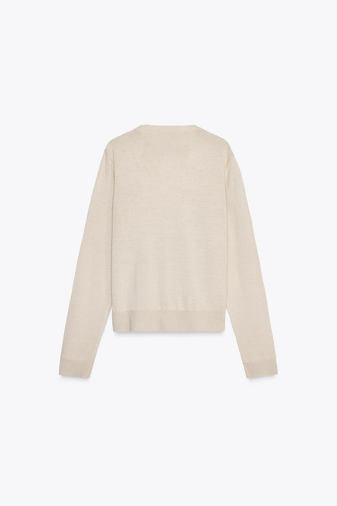 PULL EN MAILLE UNIE AVEC LAINE
