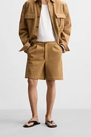 PLEATED FAUX SUEDE SHORTS