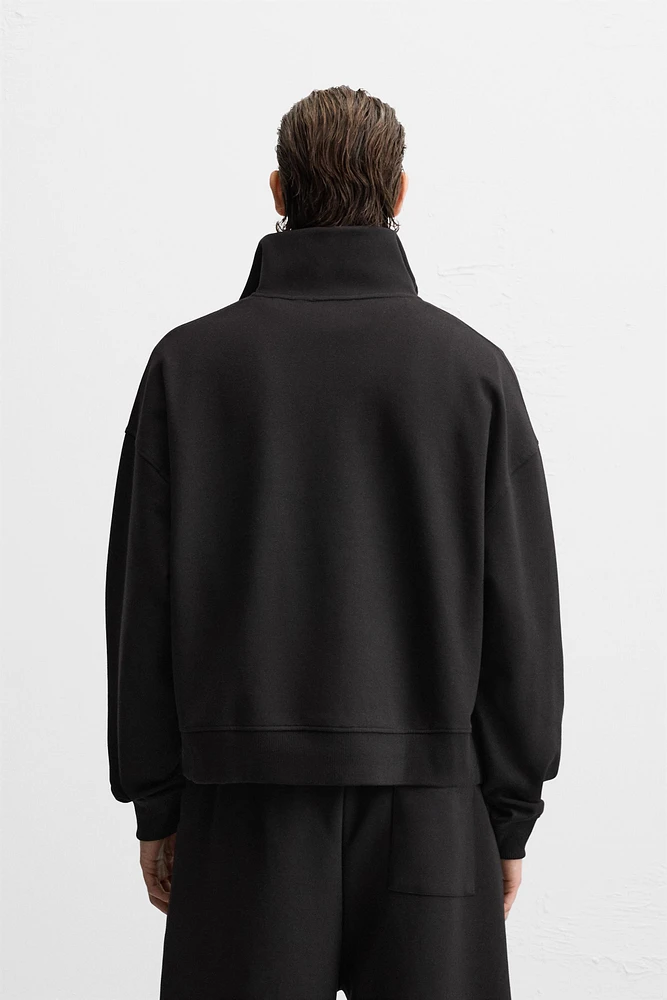 TECHNICAL QUARTER-ZIP SWEATSHIRT