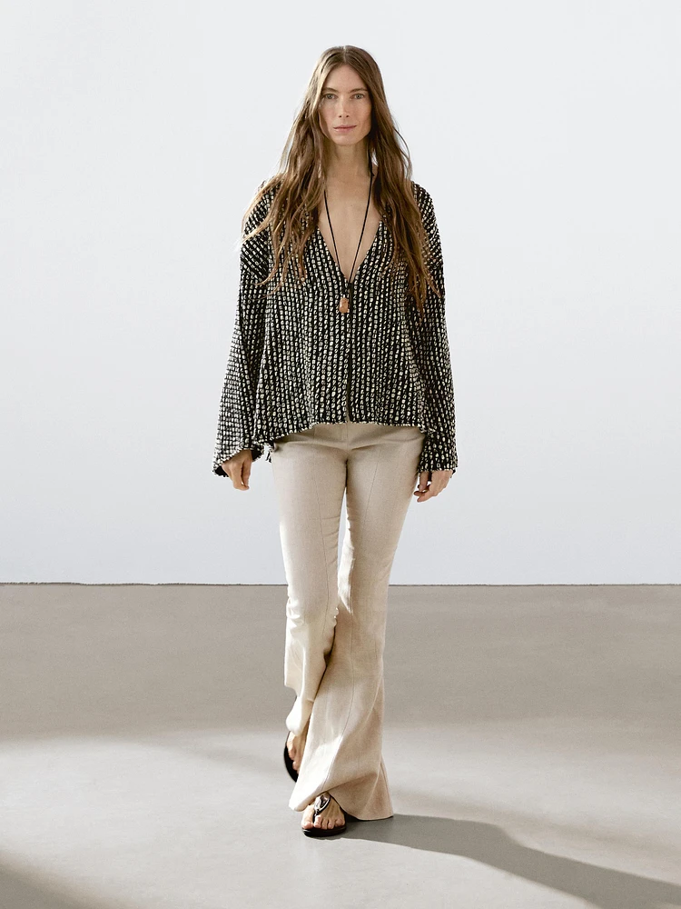 Pantalon flare taille contrastante