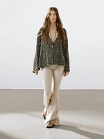 Pantalon flare taille contrastante