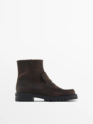 Bottines à semelle crantée avec patte