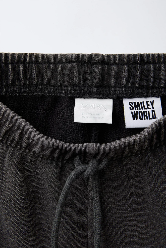 SMILEYWORLD ® WASHED EFFECT PLUSH SHORTS
