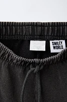 SMILEYWORLD ® WASHED EFFECT PLUSH SHORTS