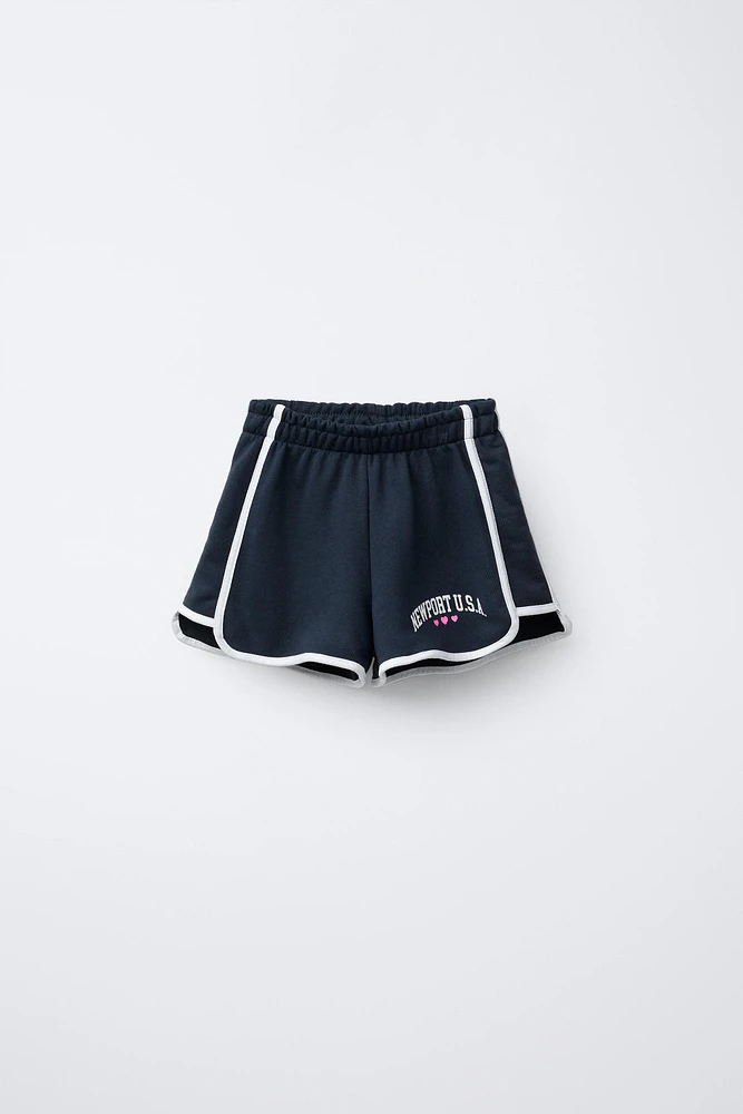 VARSITY PRINTED PLUSH SHORTS