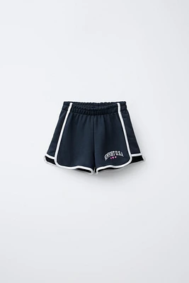 VARSITY PRINTED PLUSH SHORTS