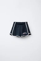 VARSITY PRINTED PLUSH SHORTS