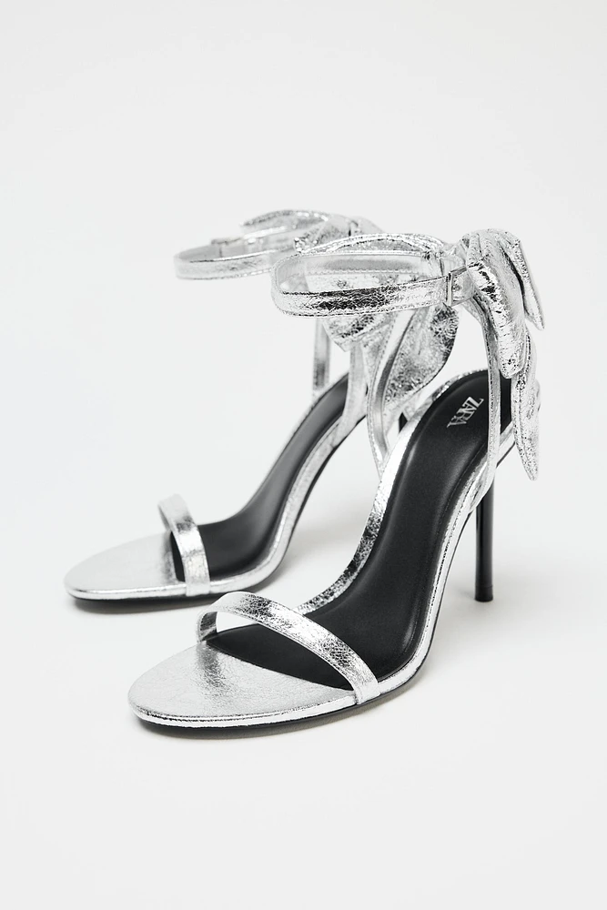 METALLIC EFFECT BOW SANDALS