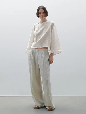 Short flowing blouse with button detail