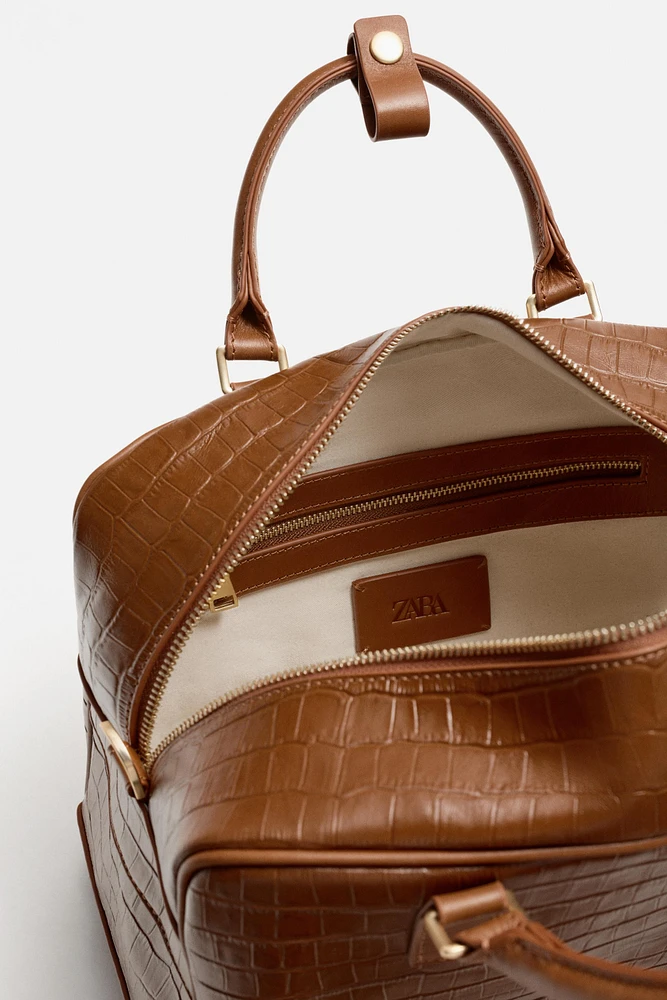 EMBOSSED LEATHER CROSSBODY BAG