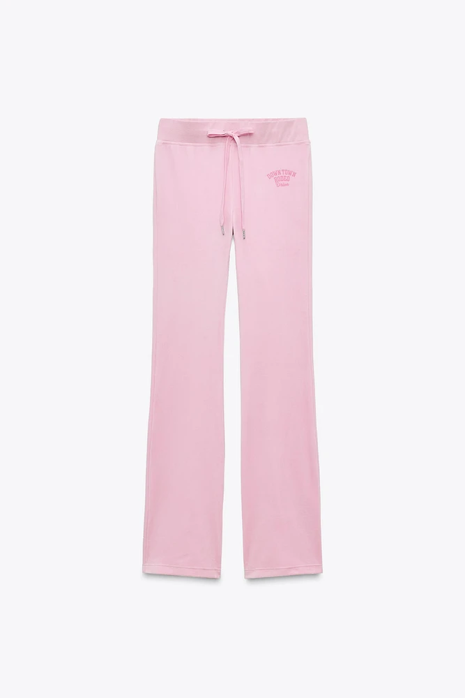 TEXT VELVET PANTS