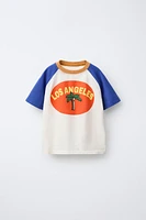 T-SHIRT À MANCHES RAGLAN ET PALMIER
