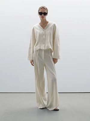 Cotton blend trousers with embroidered details