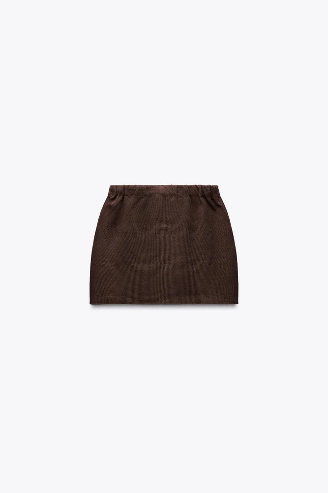MINI JUPE EN MAILLE UNIE