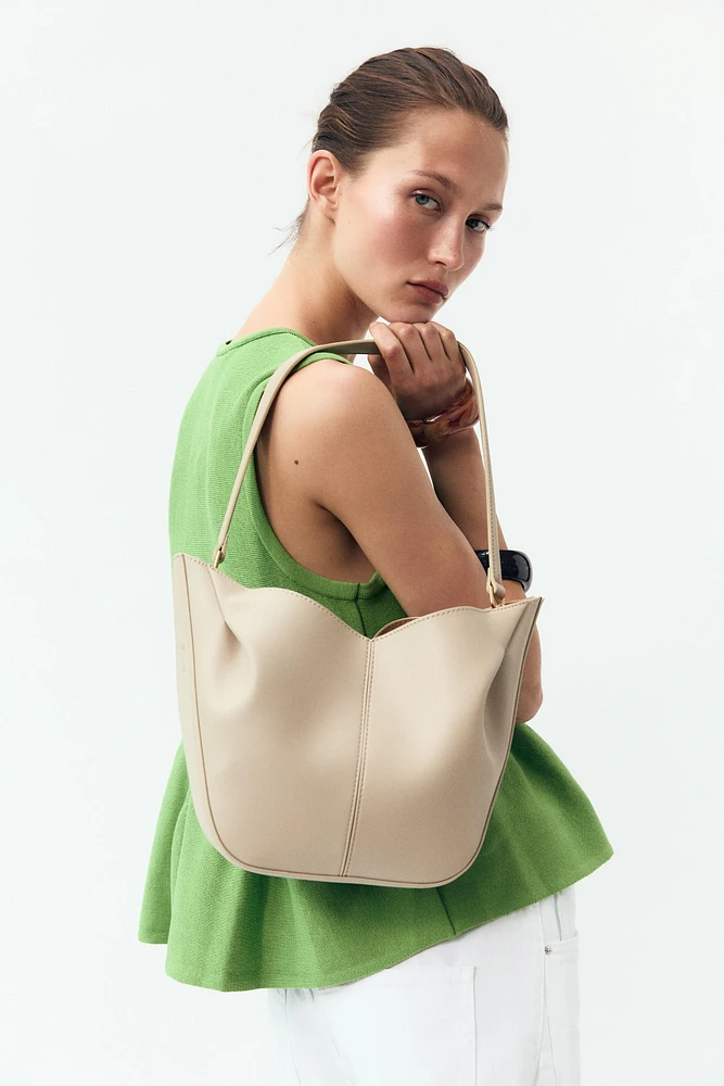 TOP EN MAILLE PÉPLUM