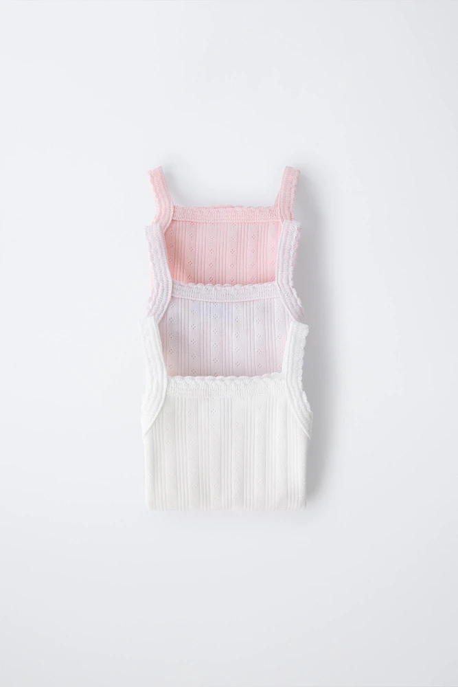 THREE-PACK OF RIB KNIT BODYSUITS WITH CUTOUT DETAIL