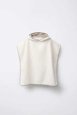 PONCHO SERVIETTE GAUFRÉ LISERÉ FLEURS