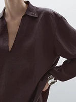 Flowing shirt featuring long sleeves with vents
