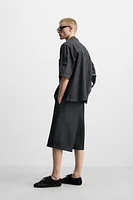 PLEATED WIDE LEG BERMUDA SHORTS